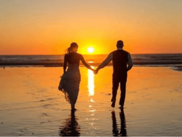 Couple enjoying honeymoon sunset at Lakshadweep beach